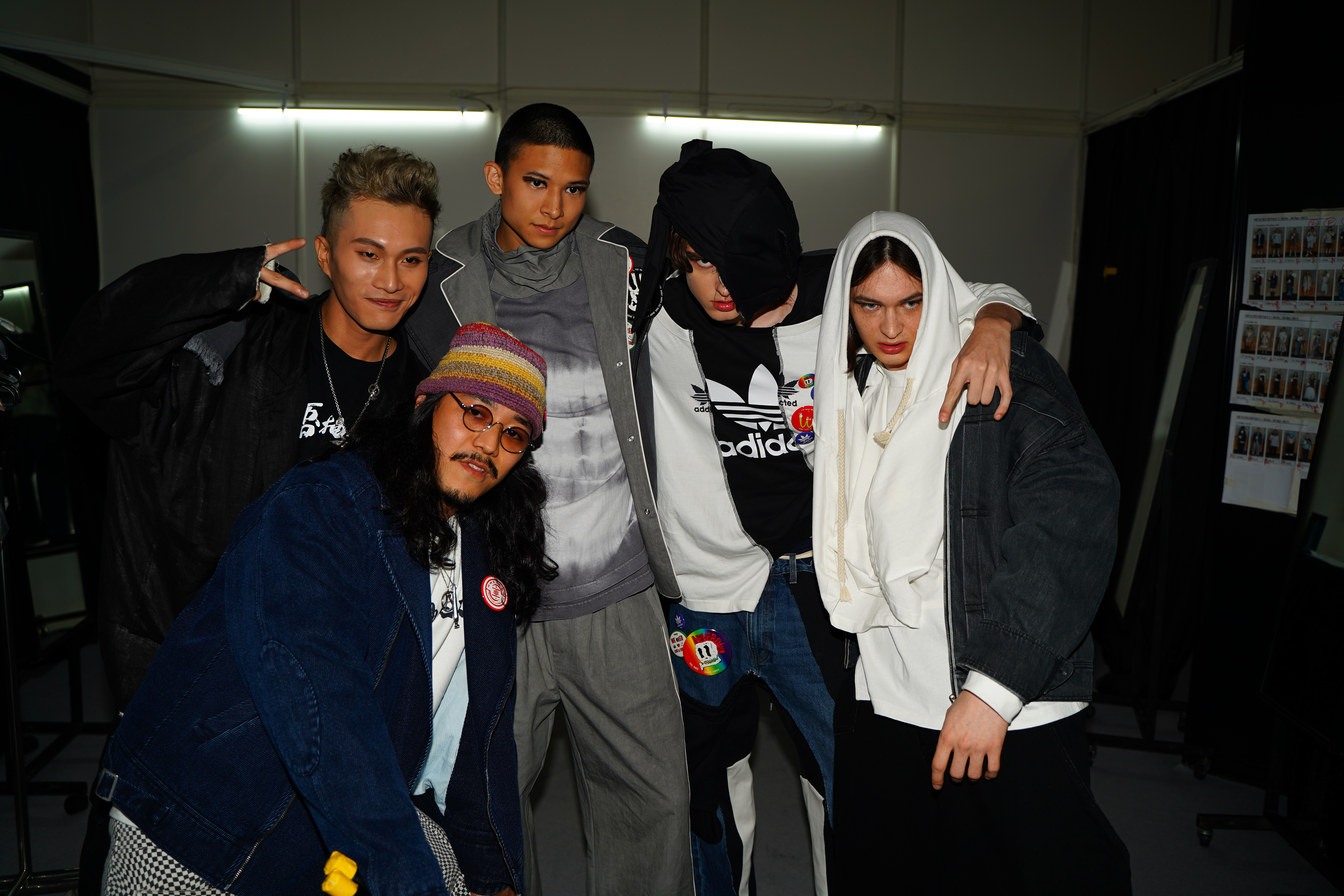 Jason (Left), fashionshow performing guest Rapper Wolfe and models at the backstage